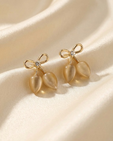Gold bow drop earrings