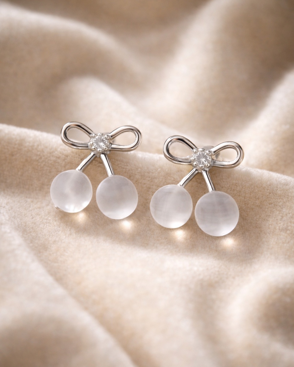 Bow design pearl stud earrings